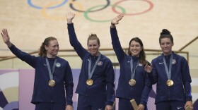From left, United States' Lily Williams, Jennifer Valente, Kristen Faulkner and Chloe Dygert pose with the gold medal of the women's team pursuit event, at the Summer Olympics, Wednesday, Aug. 7, 2024, in Paris, France.