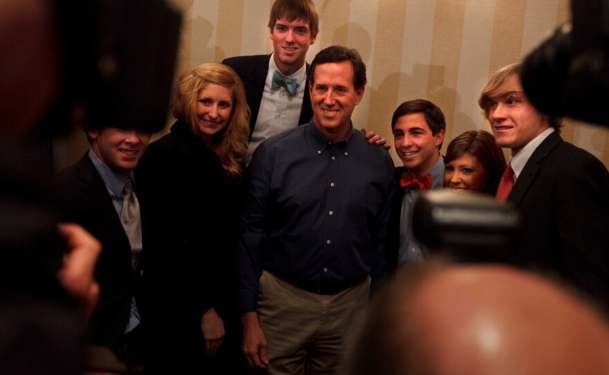 Santorum poses for a picture with supporters after his appearance at the convention.