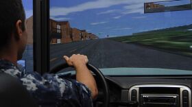 Intelligence Specialist Seaman Cory Bottie drives a simulator during the Save a Life Tour.