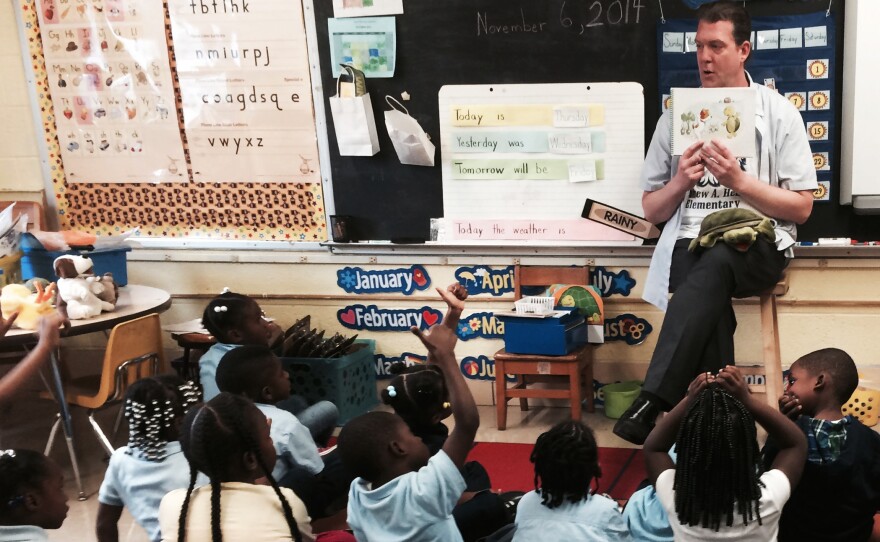 Thomas O'Donnell reads about Twiggle the Turtle to his kindergartners at Matthew Henson Elementary School in Baltimore.