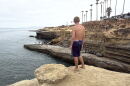 Enzo Bledsoe stands ready to cliff jump at Pappy's Point at Sunset Cliffs, Aug. 5, 2026.