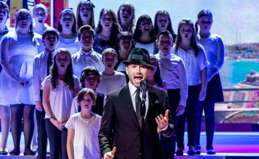 Tenor Victor Micallef and choir.