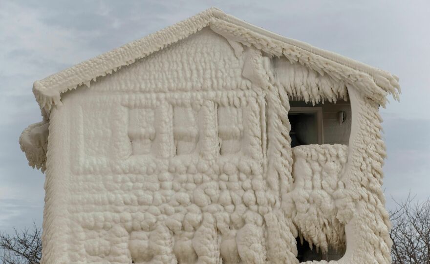 Ice clings to the facade of frozen homes in the waterfront community of Crystal Beach in Fort Erie, Ontario, Canada.