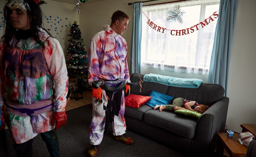 Kieran Glass (left) waits for a drink while Tristan Glass checks on Jake Swain, who is fast asleep. Most children are terrified of the Okalolies and will cry or hide when they approach. Jake, however, was utterly unimpressed and slept through most of the day.