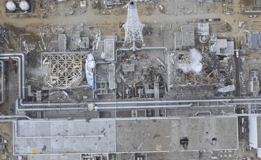 This photo, from March 20, shows the damaged buildings of reactor 4 (left) and reactor 3. Reactor 4 was shut down for routine maintenance at the time of the earthquake and tsunami, but two fires broke out on March 15 and 16, caused by the buildup of hydrogen gas.