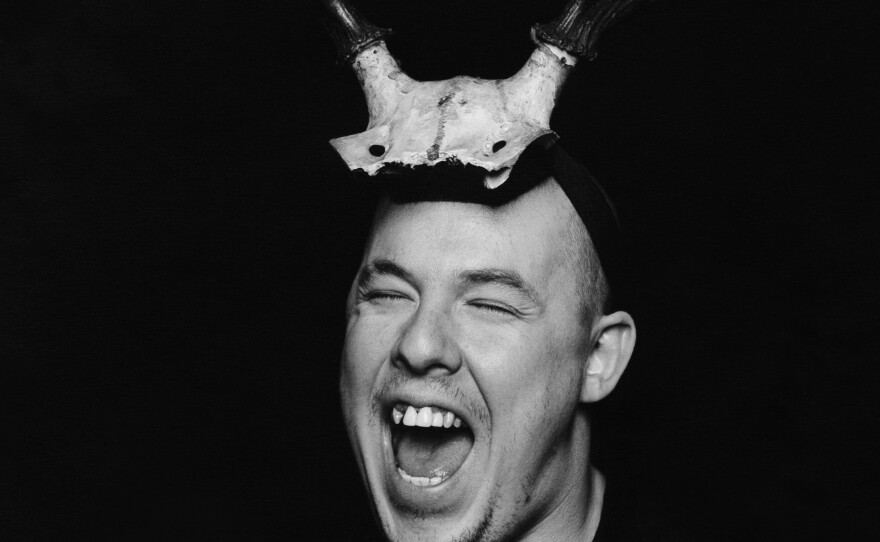 This 1997 portrait of Alexander McQueen wearing antlers is part of London's Victoria & Albert Museum exhibition honoring the late designer and his work.