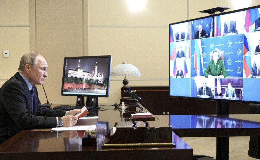 Russian President Vladimir Putin authorized a campaign to help former President Donald Trump and undermine President Biden in last year's election, according to U.S. intelligence. Putin is shown here on March 12 at a residence outside Moscow.