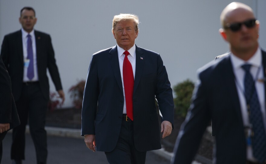President Donald Trump walks to an interview on the North Lawn of the White House June 15.