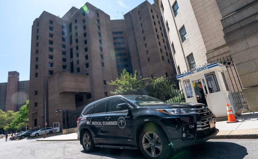 A New York Medical Examiner's car is parked outside the Metropolitan Correctional Center where financier Jeffrey Epstein was being held in New York. Epstein committed suicide in prison.