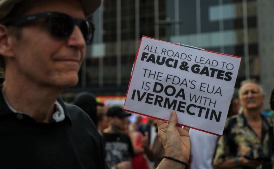 A protester at a September rally to protest vaccination mandates in New York City carries a sign supporting ivermectin.