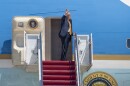 President Donald Trump waves from the doorway of Air Force One at Joint Base Andrews, Maryland, May 12, 2026.