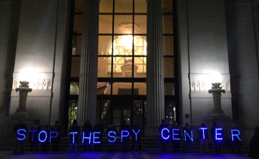 Protesters line up outside City Hall in Oakland, Calif., to demonstrate against the Domain Awareness Center, a data integration system being built by the city and the Port of Oakland.