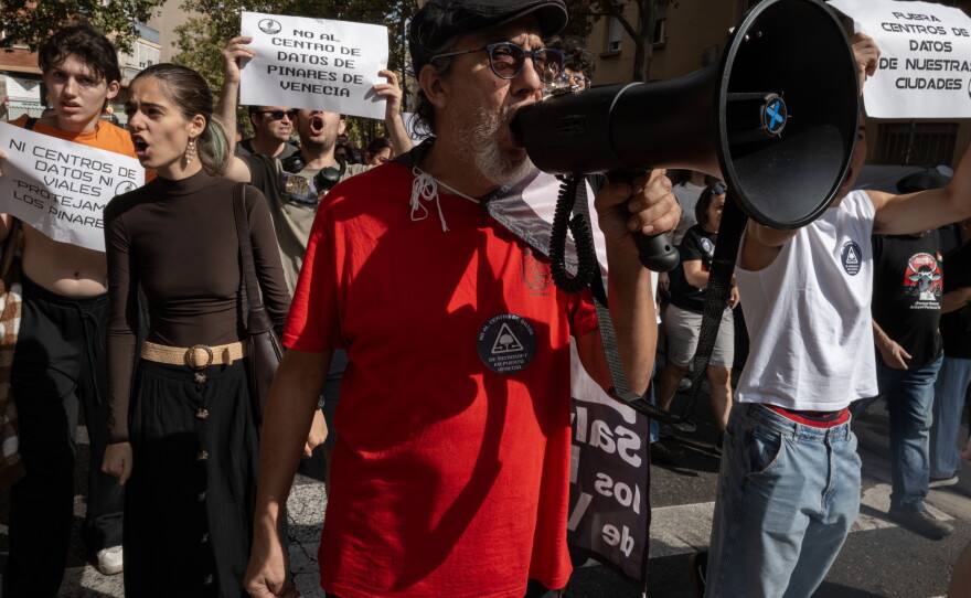 Hundreds of protesters walk through the streets of Zaragoza, Spain, on Sept. 27. The Spanish region of Aragon is seeing a huge surge in data center construction, which has alarmed many local residents due to their high energy use, noise pollution and heat generation. Microsoft and Amazon are among those building in the region.