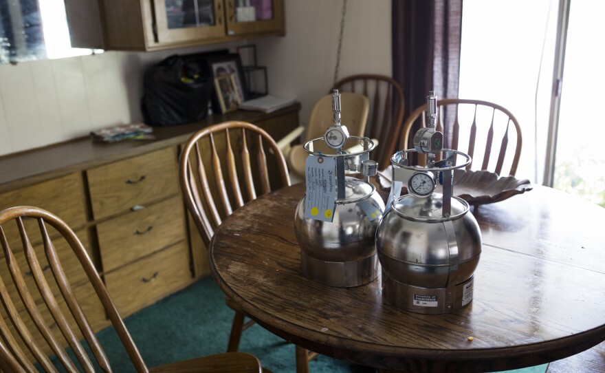 Equipment for measuring indoor air pollution sits on the dining table at an El Cajon home where harmful levels of chemical vapors have been found. July 18, 2017. 