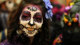 A woman disguised as "Catrina" poses for a photo in Guadalajara, Mexico. La Catrina is the Mexican representation of death, created 100 years ago by Mexican artist Jose Guadalupe Posada.