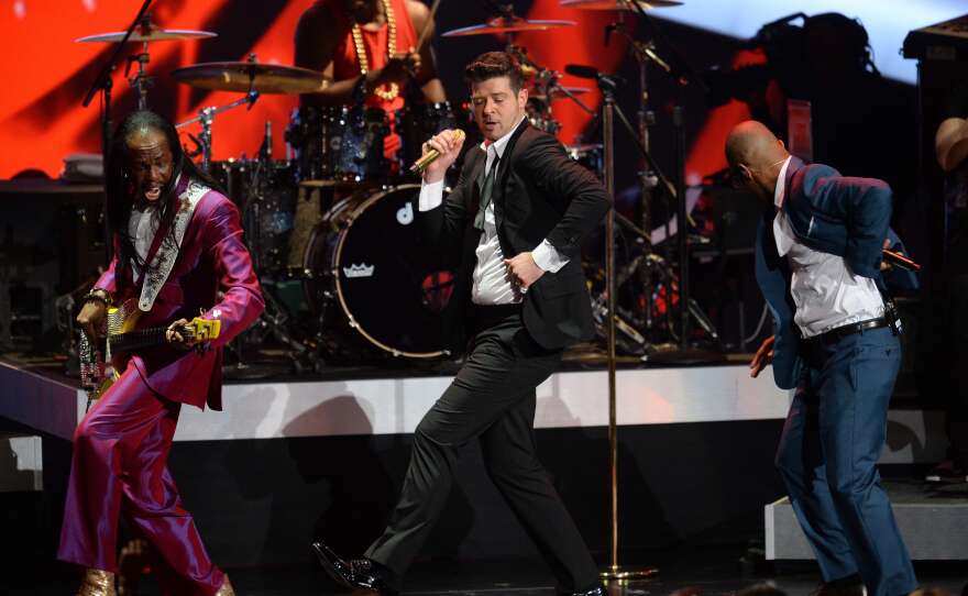 Robin Thicke, center, performs with Verdine White, left, and T.I. at The Grammy Nominations Concert Live!! in Los Angeles in December. Thicke is nominated for Outstanding Male Artist at the NAACP Image Awards this year.