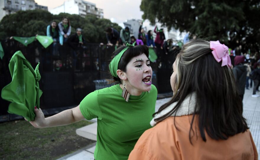 A pro-choice activist (in green) argues with a woman opposed to the legalization of abortion outside the Argentine Congress in Buenos Aires on June 13, 2018 — the year that Argentina legalized abortion.