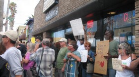 Protesters for and against a controversial bumper sticker that reads "Welcome to Ocean Beach/Please don't feed our bums" gather in front of a store that sells the stickers on June 23, 2010 in Ocean Beach.