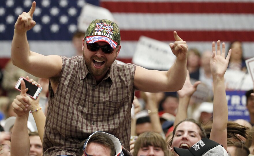A supporter cheers with the crowd before Donald Trump speaks at a campaign event in Berlin, Md., on Wednesday.