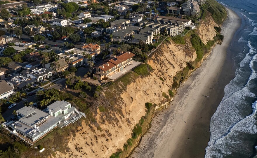 An aerial view of houses along a coastal bluff at Boneyard Beach in Encinitas on Sept. 3, 2024.