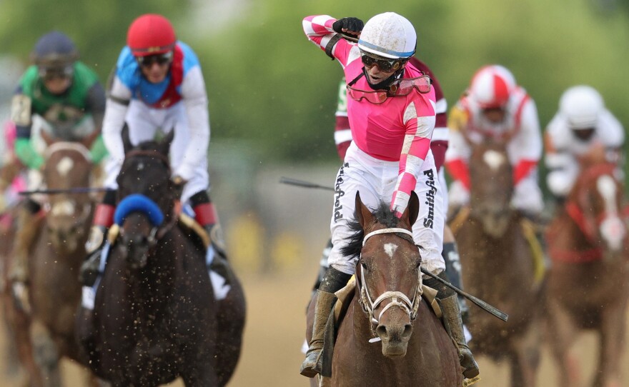 Jockey Flavien Prat, #6, riding Rombauer, celebrates as he wins the 146th running of the Preakness Stakes at Pimlico Race Course on Saturday in Baltimore.