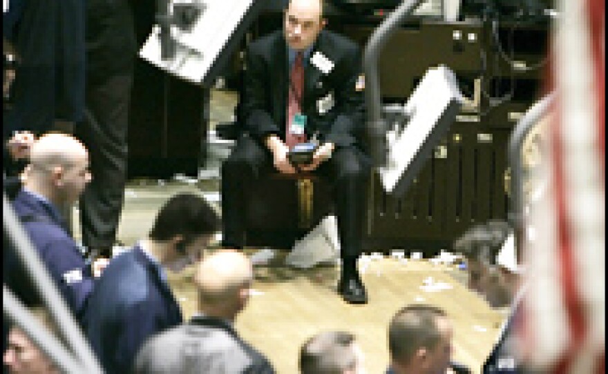 Traders on the floor of the New York Stock Exchange on March 13, when news of high foreclosure rates sent the Dow Jones Industrial average to its second-largest loss of the year.