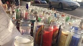 Cars drive past a memorial for Jonathan Cortez at 54th and Lea streets Oct. 12, 2015. Cortez was killed there in a hit and run Oct. 9, 2015.