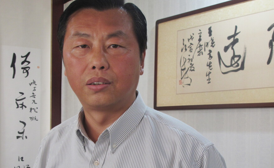 Former civil servant Wang Xiaofang is the author of 13 books on "bureaucracy literature," including <em>The Civil Servant's Notebook</em>, which recently was translated into English.