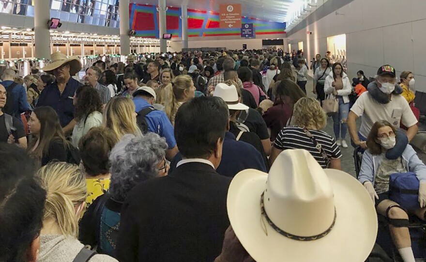 People waited in line to go through the customs at Dallas/Fort Worth International Airport on Saturday as staff took extra precautions to guard against the coronavirus.