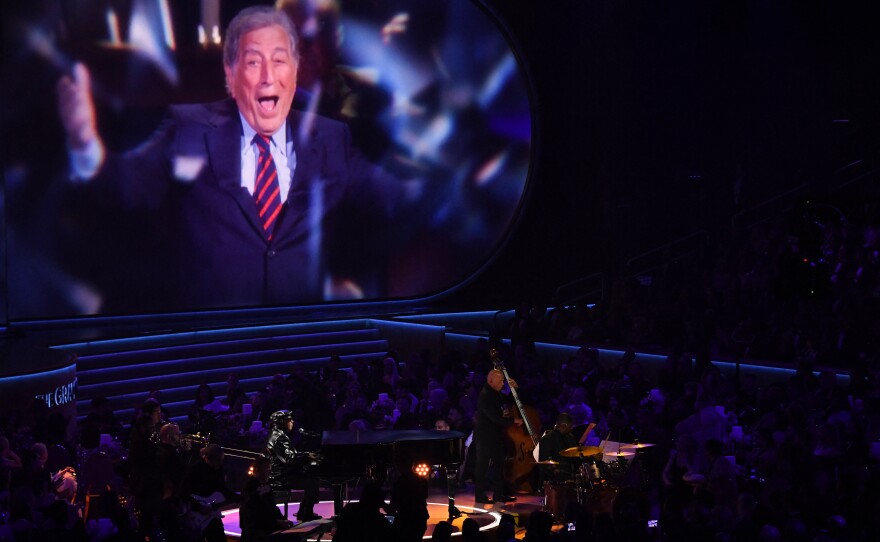 Stevie Wonder performs on stage honoring Tony Bennett during the 66th annual Grammy Awards.