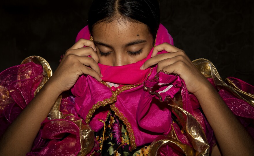 Mariangel prepares to dance. "My mom has always told me since I was a little girl that you have to be responsible, that you can't say 'I want to do this' and then stop. That you can't say 'I want to do this' and then quit. No! If I want to do that, I have to finish it and do it well."