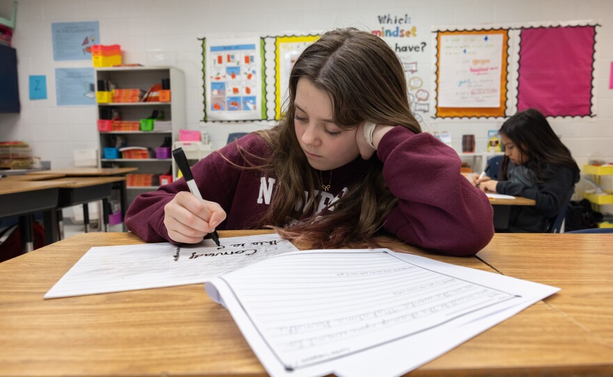 Conrad Thompson is proud of her cursive skills.