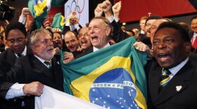 Brazil's President Luiz Inacio Lula da Silva, left, Rio 2016 bid President Carlos Arthur Nuzman, center, and Brazilian soccer great Pele, right, celebrate with their delegation after it was announced that Rio de Janeiro has won the bid to host the 2016 Summer Olympic Games at the Bella Center on October 2, 2009 in Copenhagen, Denmark. The 121st session of the International Olympic Committee (IOC) voted to give Rio de Janeiro the hosting role of the 2016 Olympics over Chicago, Tokyo and Madrid.