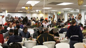Hundreds of people eat a Thanksgiving meal at the San Diego Rescue Mission.