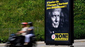 A poster reading "Isolate ourselves from Europe? Certainly not now! - No to the SVP/UDC Chaos initiative" featuring images of President Donald Trump, Russian President Vladimir Putin and Chinese President Xi Jinping, urging people to vote against the Swiss People's Party (SVP) referendum titled "No to a Switzerland with 10 million inhabitants" photographed in Lausanne, May 27, 2026.