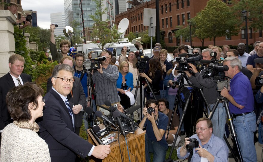 Democrat Al Franken, with his wife, Frannie, meets reporters and a small gathering of supporters at their house in Minneapolis on June 30, 2009, after the Minnesota Supreme Court ruled in favor of the Democrat in the Senate race against Republican Norm Coleman.