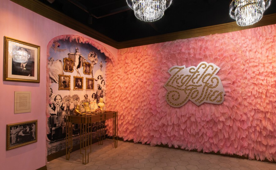 The Ziegfeld Follies room is wallpapered with pink feathers.