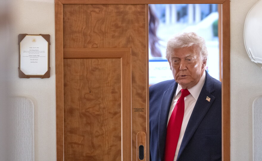President Donald Trump arrives to speak to reporters aboard Air Force One en route from Joint Base Andrews, Md., to Eau Claire, Wis., Friday, June 5, 2026.