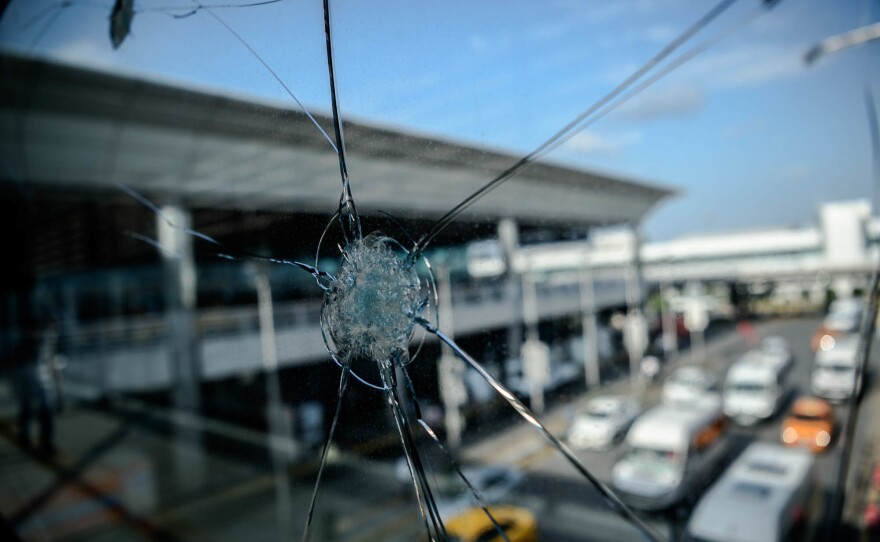 Bullet impacts mar a window at Ataturk Airport in Istanbul on June 29, 2016, the day after a suicide bombing and gun attack targeted the airport, killing 45 people.