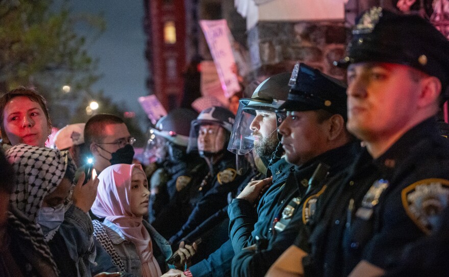 Pro-Palestinian supporters confront police during demonstrations at The City College of New York as the NYPD cracks down on protest camps at both Columbia University and CCNY on April 30, in New York City.