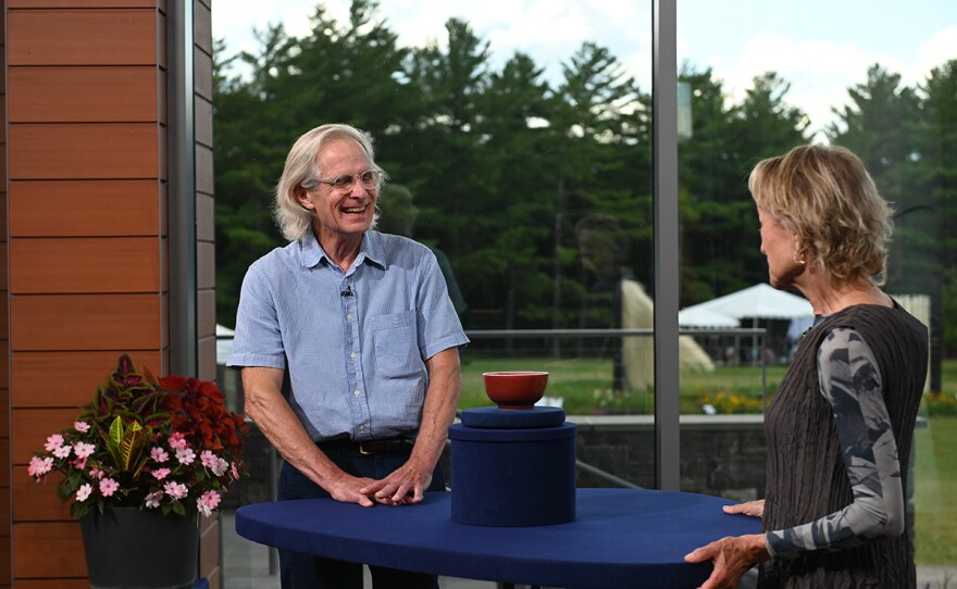 Dessa Goddard (right) appraises a Chinese Kangxi Period copper-red porcelain bowl, in Shelburne, Vt.