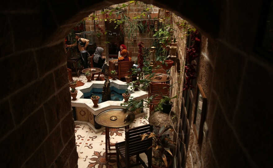 Palestinians sit inside Beit Sitti, Arabic for "my grandmother's house," in Gaza's Old City on Dec. 19, 2017. The cafe is an ode to Palestinian cultural heritage.