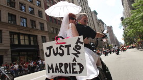 A couple on their motorcycle make a statement about the contentious issue of gay marriage while participating in the annual New York City Gay Pride March on June 28, 2009 in New York City. The year's march commemorates the 40th anniversary of the Stonewall riots.