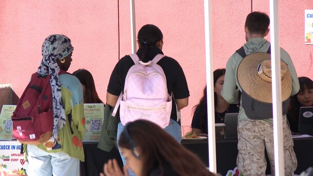 San Diego City College students speak with Basic Needs Center staff at a CalFresh application event on Tuesday, Oct. 28, 2025.