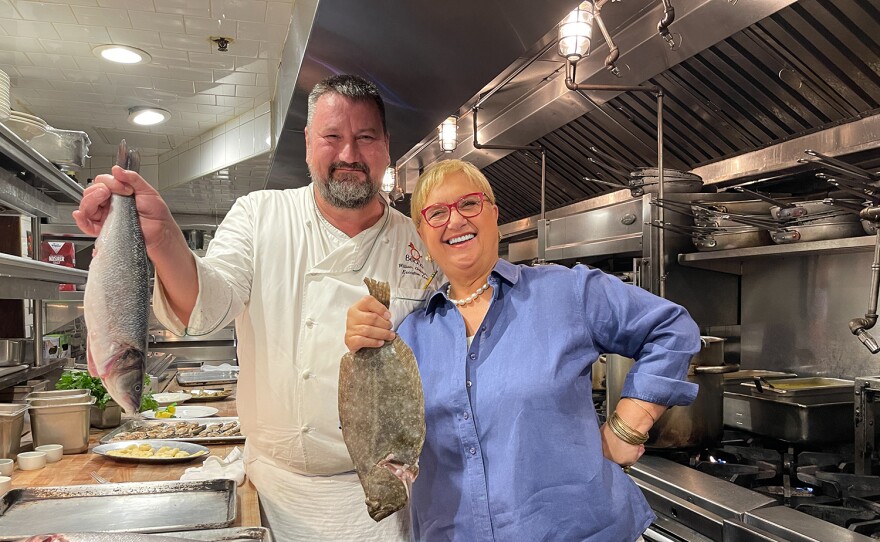 Chef Lidia Bastianich prepaing a meal with Chef Gallagher in the Becco kitchen.