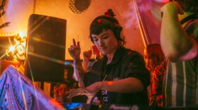 A DJ performs a set at an Afternoon Umbrella Friends event at Kava Lounge in December 2019.