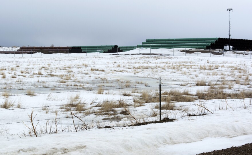 This March 11, 2020 photo provided by the Bureau of Land Management shows a storage yard in Montana for pipe that was to be used in construction of the Keystone XL oil pipeline. The developer has now canceled the controversial project.