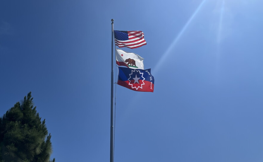 Juneteenth flag raised along with the American flag and California state flag during a special celebration at the San Diego Unified School District education center in Hillcrest, San Diego on June 16, 2023.
