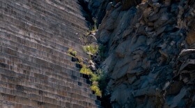 More than 300-feet of stepping concrete of the Olivenhain Dam meets the rocky valley wall holding back more than 46-thousand cubic feet of water in Northern San Diego County's Elfin Forest Recreational Reserve, Aug. 26, 2022.