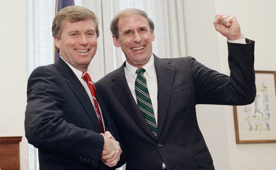 Newly sworn-in Sen. Dan Coats, right, shakes hands with Vice President-elect Dan Quayle in 1989 after Coats took the Senate oath. Coats was chosen to succeed Quayle as senator.